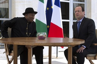 French President Francois Hollande (R) meets with Nigeria's President Goodluck Jonathan (L), during an African security summit