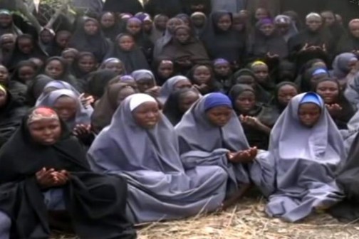 Kidnapped Chibok schoolgirls wearing the full-length hijab and praying in an undisclosed rural location