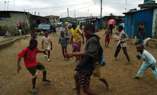 Children playing football on the street