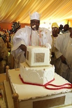Oba Dr. Sikiru Kayode Adetona cuts his birthday cake
