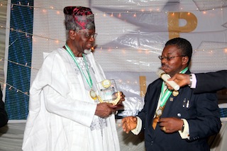 Engr. Bosun Oke (Left) receiving an award from The Chairman Ijebu Professional Excellence Foundation (IPEF) Chief Olusegun Osideko