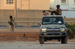 Libyan men loyal to rogue general Khalifa Haftar take position during clashes against Islamists AFP