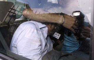 Wojciech Janowski, the son-in-law of the 77-year old heiress Helene Pastor, leaves a police station in Nice