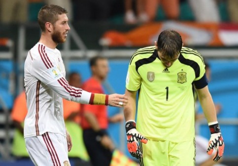 Spain's keeper, Casillas, right,  being  consoled by Sergio Ramos. AFP