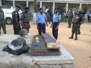 Commissioner of Police, Shenaba inspecting the explosives