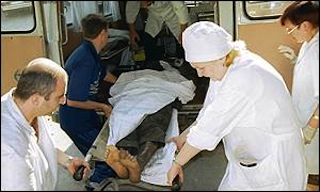 Mine blast victim carried into an ambulance by medics Photo: BBC