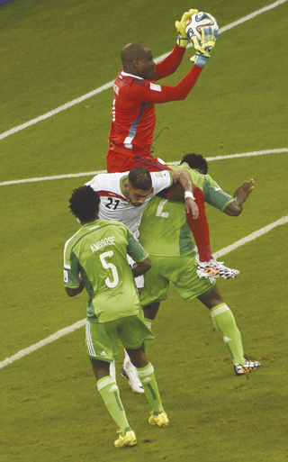 FIRM GRIP...Nigeria's Super Eagles goalkeeper and captain Vincent Enyeama makes a save during a Group F match between Iran and Nigeria at the Baixada Arena in Curitiba at the 2014 FIFA World Cup on 16 June, 2014. AFP PHOTO.
