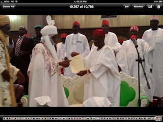 Governor Rabi'u Musa Kwankwaso of Kano state formally presenting a letter of appointment to the new Emir of Kano, His Highness Sanusi Lamido Sanusi at Africa House, Government House, Kano