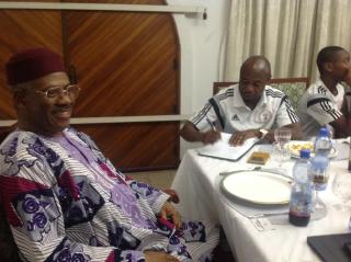 Coach Emmanuel Amuneke signs the guest register