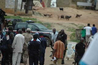 Abolurin is confronted by the policemen