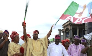 Peoples Democratic Party's Legal Adviser in the State of Osun, Barrister John Abolarinwa Abidoye (middle); Acting Chairman of Alliance for Progressive Congress (APC), Elder Adelowo Adebiyi (4th right); Chief of Staff to Osun Governor, Mr. Gboyega Oyetola (left); APC Assistent Public Relation Officer, Apostel Samson Oyebode (2nd right); Secretary of APC, Prince Gboyega Famodun (right). With them are Abidoye's wife, Kemi (2nd left); Shade and Lola (4th right), during the defection of the PDP Legal Adviser to APC, held at the Party Secretariat, Osogbo on Tuesday 26/08/2014