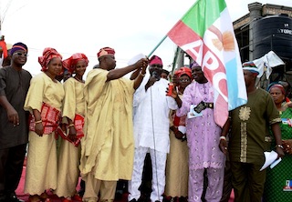 Peoples Democratic Party's Legal Adviser in the State of Osun, Barrister John Abolarinwa Abidoye (middle); Acting Chairman of Alliance for Progressive Congress (APC), Elder Adelowo Adebiyi (4th right); Chief of Staff to Osun Governor, Mr. Gboyega Oyetola (left); APC Assistent Public Relation Officer, Apostel Samson Oyebode (2nd right); Secretary of APC, Prince Gboyega Famodun (right). With them are Abidoye's wife, Kemi (2nd left); Shade and Lola (4th right), during the defection of the PDP Legal Adviser to APC, held at the Party Secretatiat, Osogbo on Tuesday 26/08/2014
