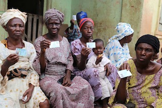 Voters diplay theres voters card before casting there vote in Ijebu Ijesa