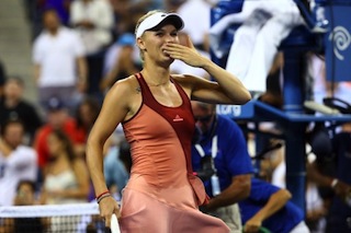 Wozniacki celebrates after defeating Sara Errani