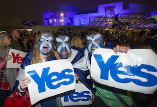 Pro-independence supporters gather at the Scottish Parliament in Edinburgh