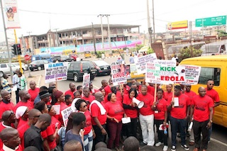 Nigerians campaigning to rise awareness on Ebola virus in the street of  Lagos.