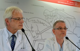 Chief doctor Bernhard Ruf (L) und senior physician Thomas Gr¸newald address a press conference at the St Georg Clinic in Leipzig