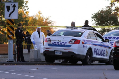 Forensic police officers at the National War Memorial in Ottawa