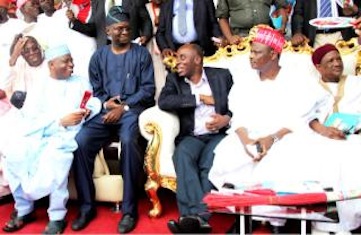 Governor Rabiu Kwankwaso (R) is joined by Governor Babatunde Fashola of Lagos State and Governor Rotimi Amaechi of Rivers State during the presidential declaration ceremony for Kwankwaso
