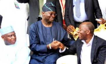 L-R: Governor Babatunde Fashola of Lagos State and Governor Rotimi Amaechi of Rivers State shake each other