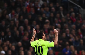Messi celebrates after scoring against Ajax