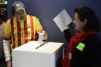 A man casts his ballot at a polling station in Barcelona on November 9, 2014