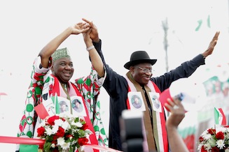 President Goodluck Jonathan (R) and Vice President Namadi Sambo greet supporters at the ceremony in Abuja
