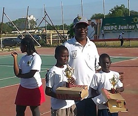 Gabriel Richard (right), tournament's most outstanding male player, during his trophy presentation at the just concluded NNPC Junior Tennis Circuit at the Murtala Square in Kaduna