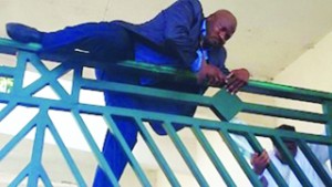 •Hon Kawu Sumaila, Deputy Minority Leader of the House of Reps, climbing NASS gate to have access to the premises today