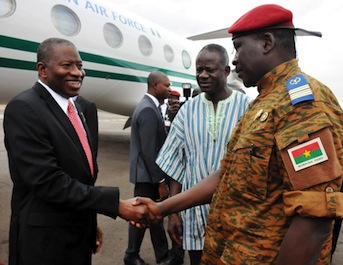 President Jonathan shake hands with the interim Head of State, Burkina Faso, Lt. Col Isaac Zida in Ouagadougou