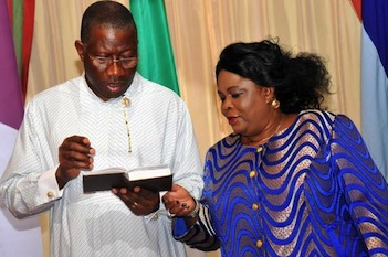 Bible Time: President Goodluck Jonathan reads the Bible as his wife, Patience looks on