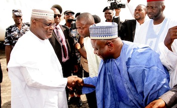 Finally! After bowing to IBB and OBJ, Atiku gets someone to bow to him...Atiku Abubakar in a handshake with Niger State Chairman of the APC, Eng M J Imam