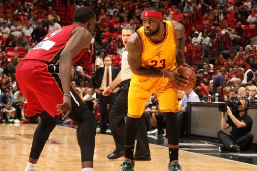 LeBron James, right, with the ball, trying to outsmart Miami Heat Luol Deng