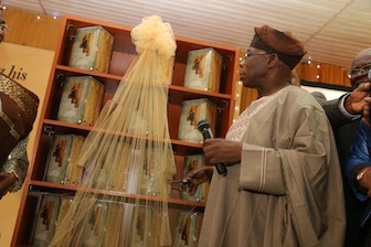 Former Nigeria President, Chief Olusegun Obasanjo cutting the tape at the presentation of 'My Watch'- A Memoir by Olusegun Obasanjo