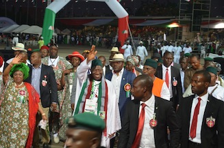 President Goodluck Jonathan and his wife, Patience, acknowledge the cheers of delegates
