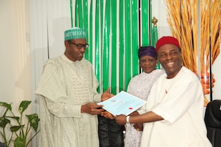 Major General Muhammadu Buhari receives his certificate from Ogbonaya Onu