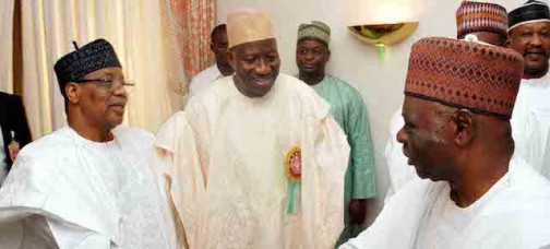 Long time no see: Jonathan watches as Ahmadu Ali, chairman of his campaign greets Babangida