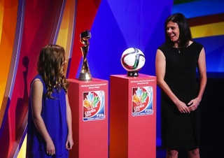 Canadian National women’s team captain Christine Sinclair stands next to the official match ball and the FIFA Women’s World Cup trophy during the FIFA Women’s World Cup Canada 2015 tournament final draw, Gatineau, Canada, on 6 December