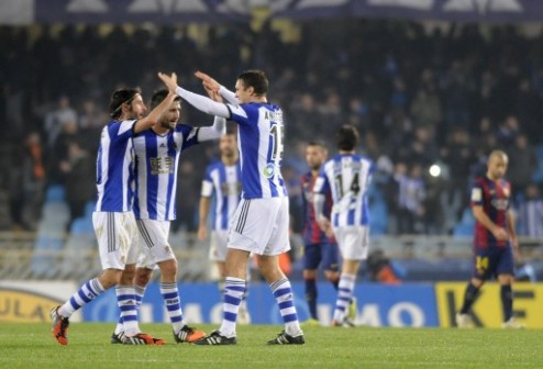 (L-R) Real Sociedad's midfielder Esteban Granero, midfielder Markel Bergara and defender Ion Ansotegi celebrate after winning the Spanish league football match