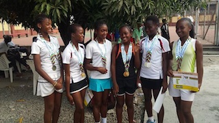 Venus Ubiebi (far left), posing with her friends after winning the bronze medal at the singles event of the Ibile Games in Lagos