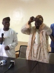 The last piece of Obasanjo's PDP membership card is shredded by Alhaji Surajudeen Oladunjoye, PDP Ward 11 Chairman in Ogun State