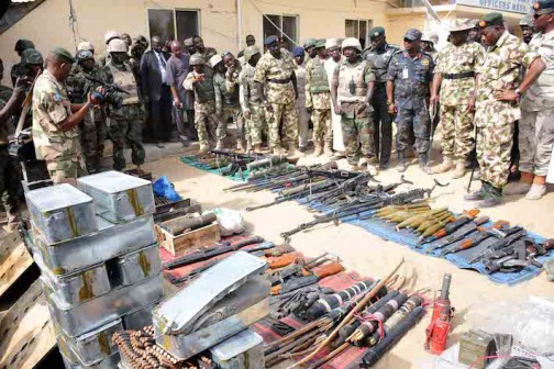 Jonathan checks the arms seized from Boko Haram
