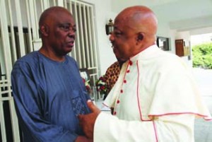 •Rev. Father Gabriel Osu with Rasak Okoya at the home of the late Okoya-Thomas this morning. PHOTOS: EMMANUEL OSODI.