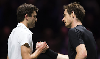 R-L: Andy Murray congratulates Gilles Simon after losing to him