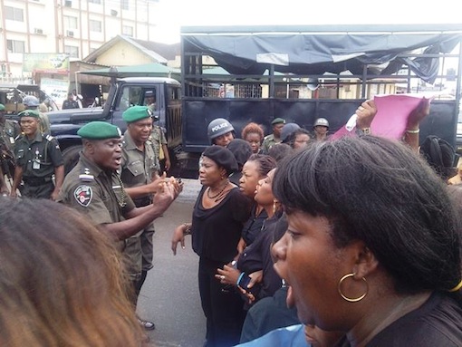 FILE PHOTO:Police officers in altercation with the protesting women   barricaded at Waterlines junction before firing teargas at them