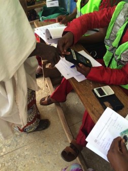 INEC official registering a voter