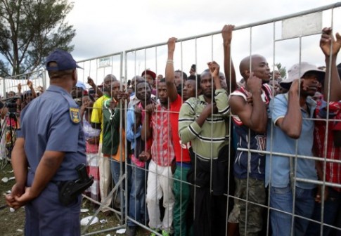 FILE PHOTO: Foreign nationals listen to President Jacob Zuma at a camp in Chatsworth, south of Durban 