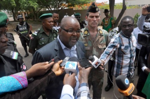 First Political Secretary of the South African High Commission in Nigeria Sthenbisi Shongwe speaks to the media outside the South African High Commission in Abuja on April 20, 2015