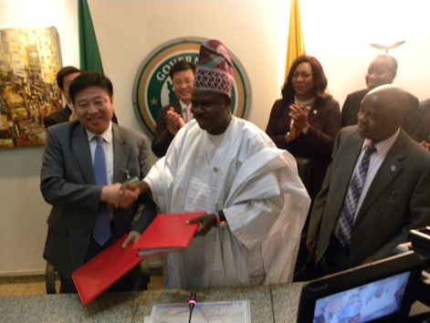 L-R: Chairman of CCECC, Mr. Cao Baogang exchanging the agreement paper with Ogun state Governor, Ibikunle Amosun after the signing today in Abeokuta