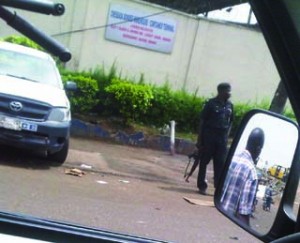 •A policeman on guard at Ladipo market, Lagos this morning
